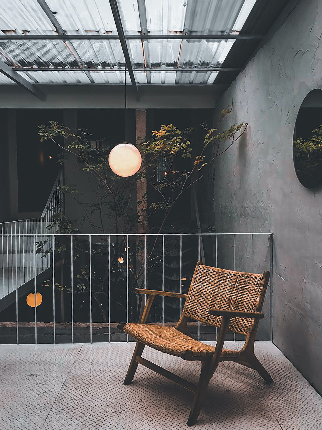 Pendant light over chair and balcony